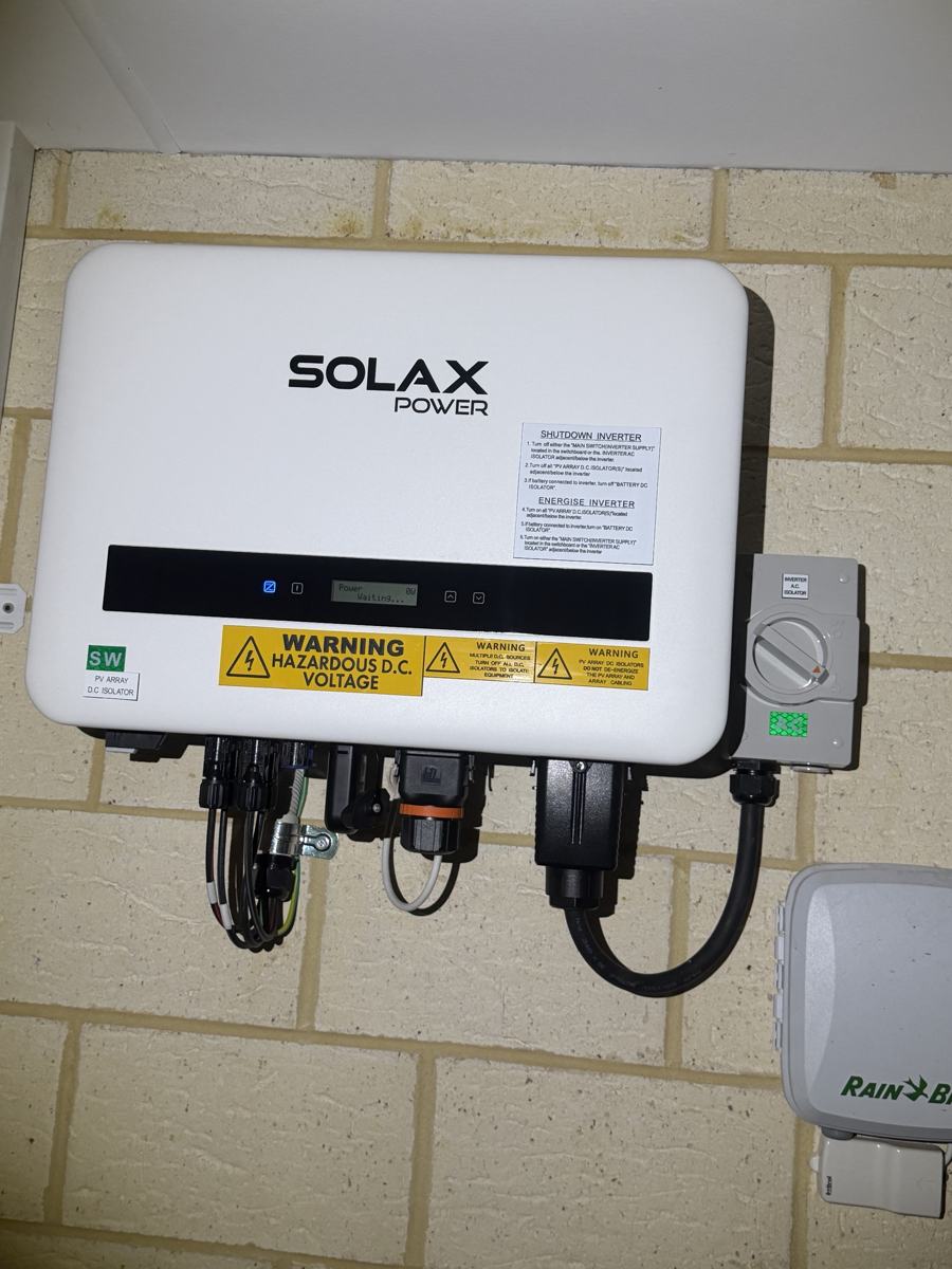 Solax solar inverter with isolators and safety labelling