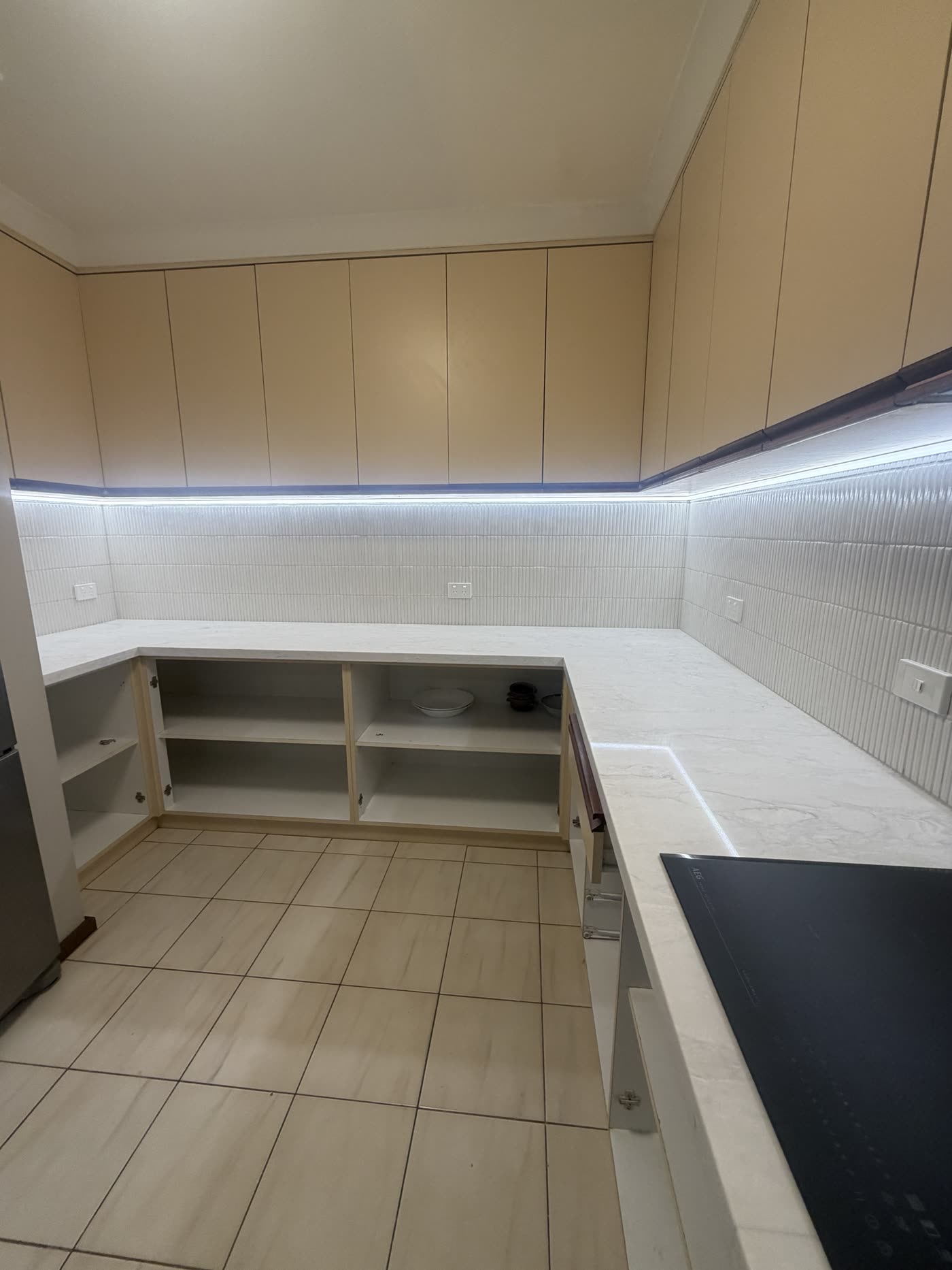 Butler's pantry with LED strip lighting under the overhead cabinets and new power points