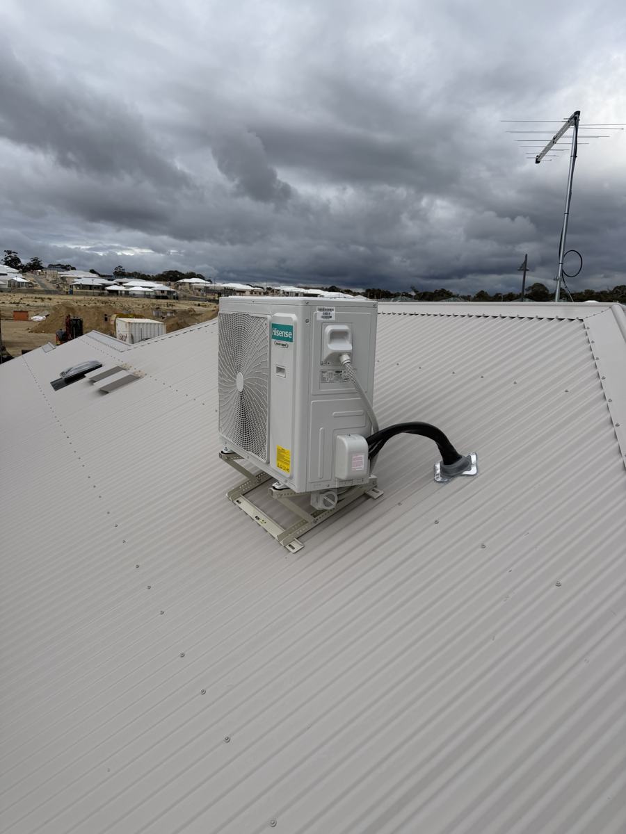 Hisense outdoor air conditioning unit mounted on a metal roof